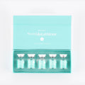 Set of vials in a Meso glutathione packaging on a light gray background