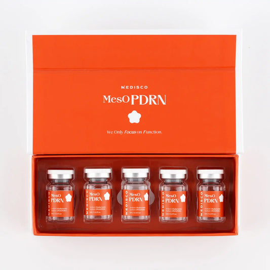Set of MesOPDRN skincare products in an orange box on a white background