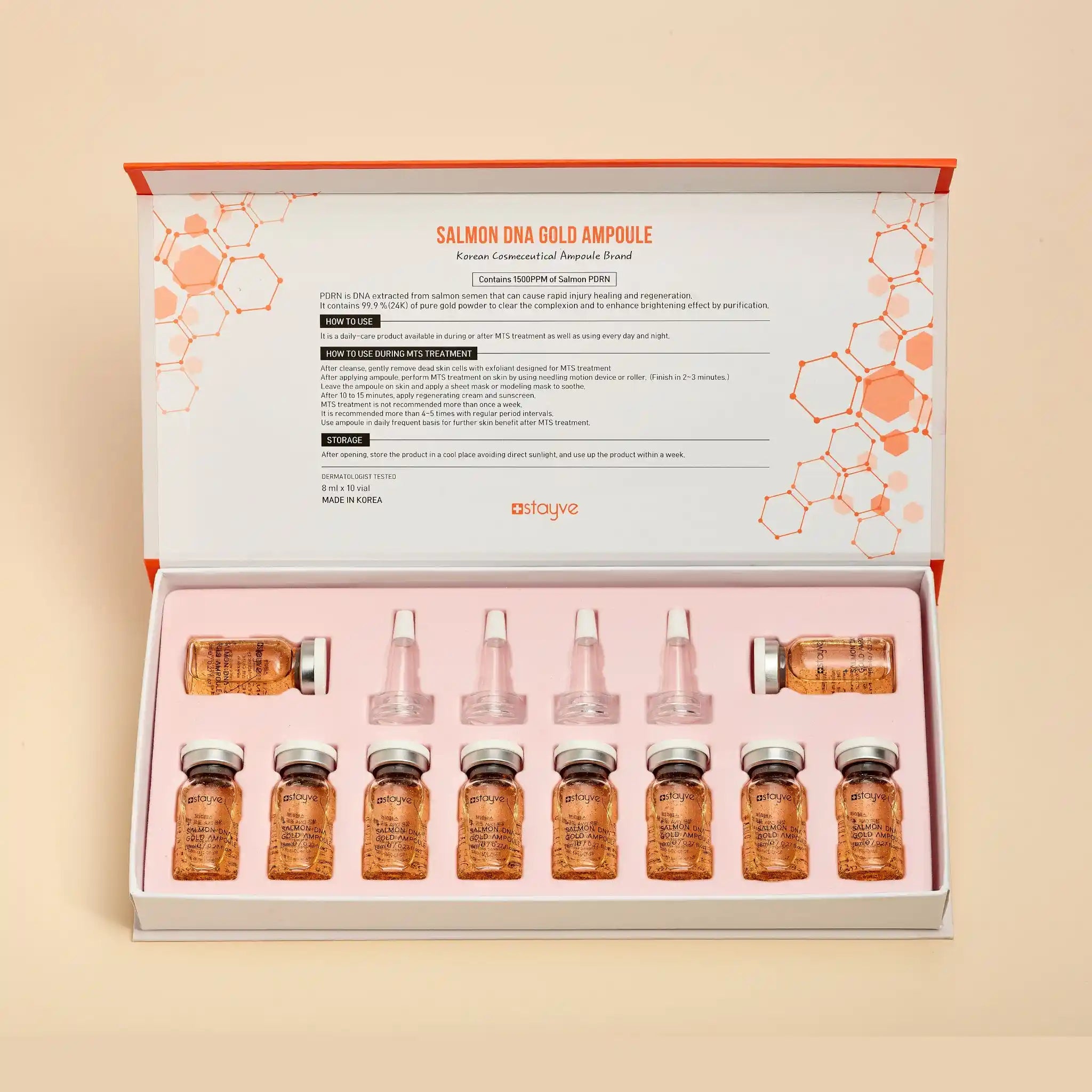 Salmon DNA Gold Ampoule set with packaging on a beige background