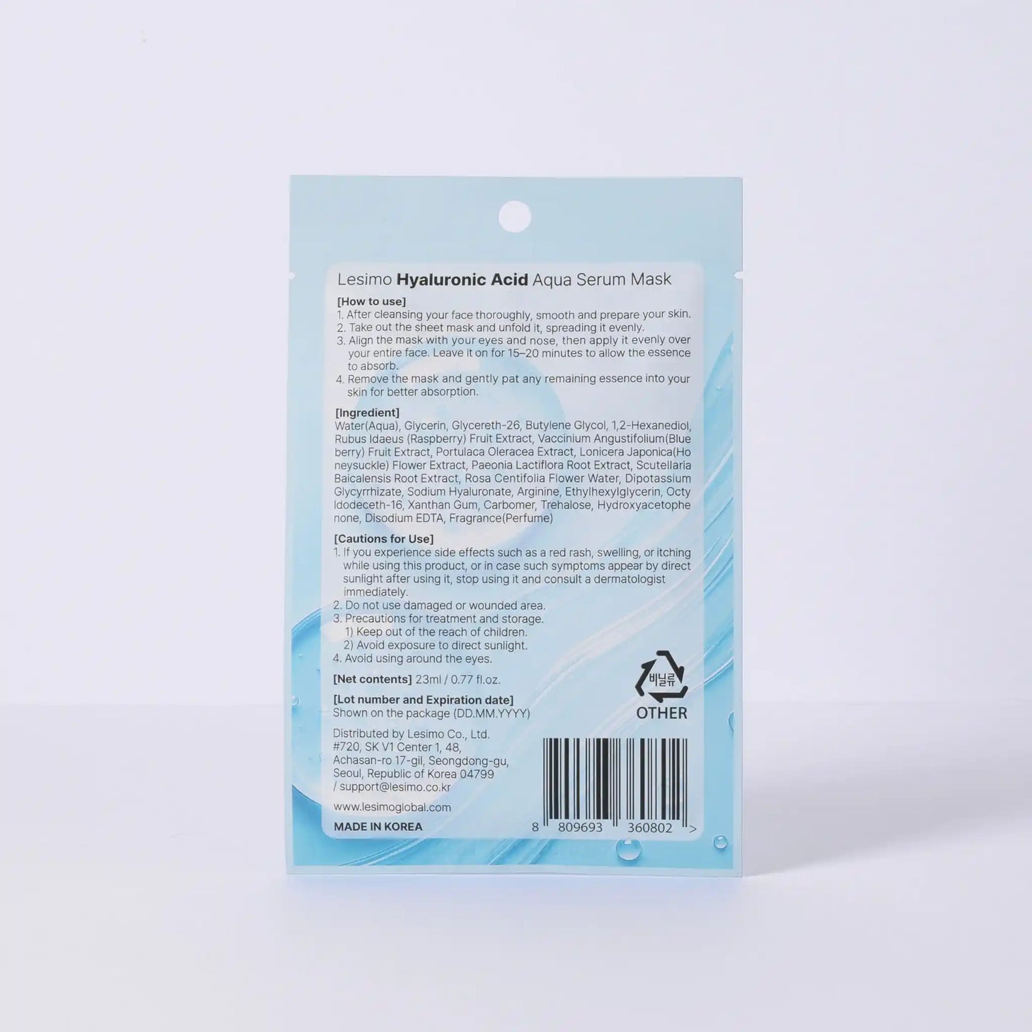 Back view of a skincare mask packaging with text and branding on a light blue background