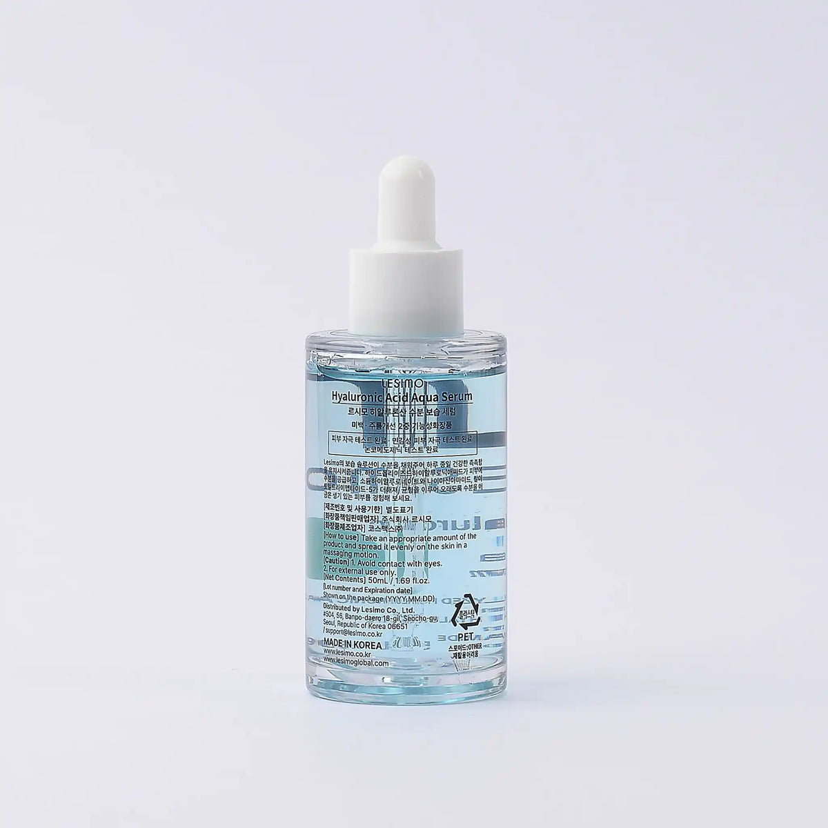 Skincare serum bottle with dropper on a light gray background