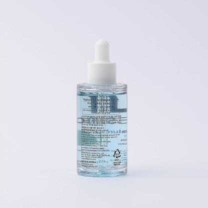 Skincare serum bottle with dropper on a light gray background