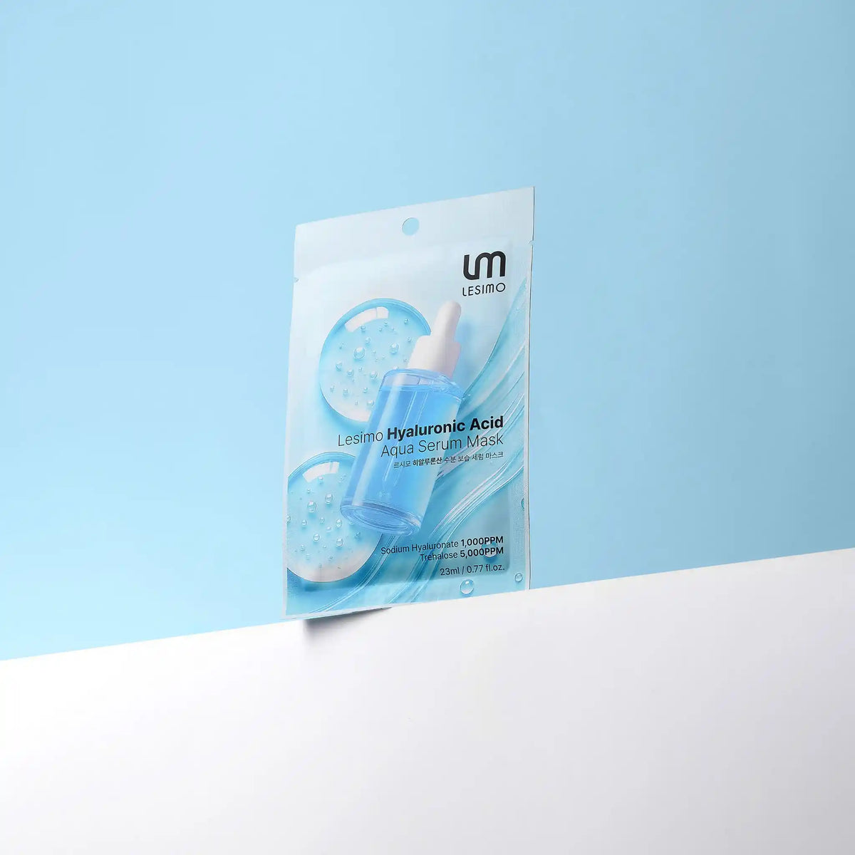 Lesimo Hyaluronic Acid Aqua Serum Mask packaging on a light blue background