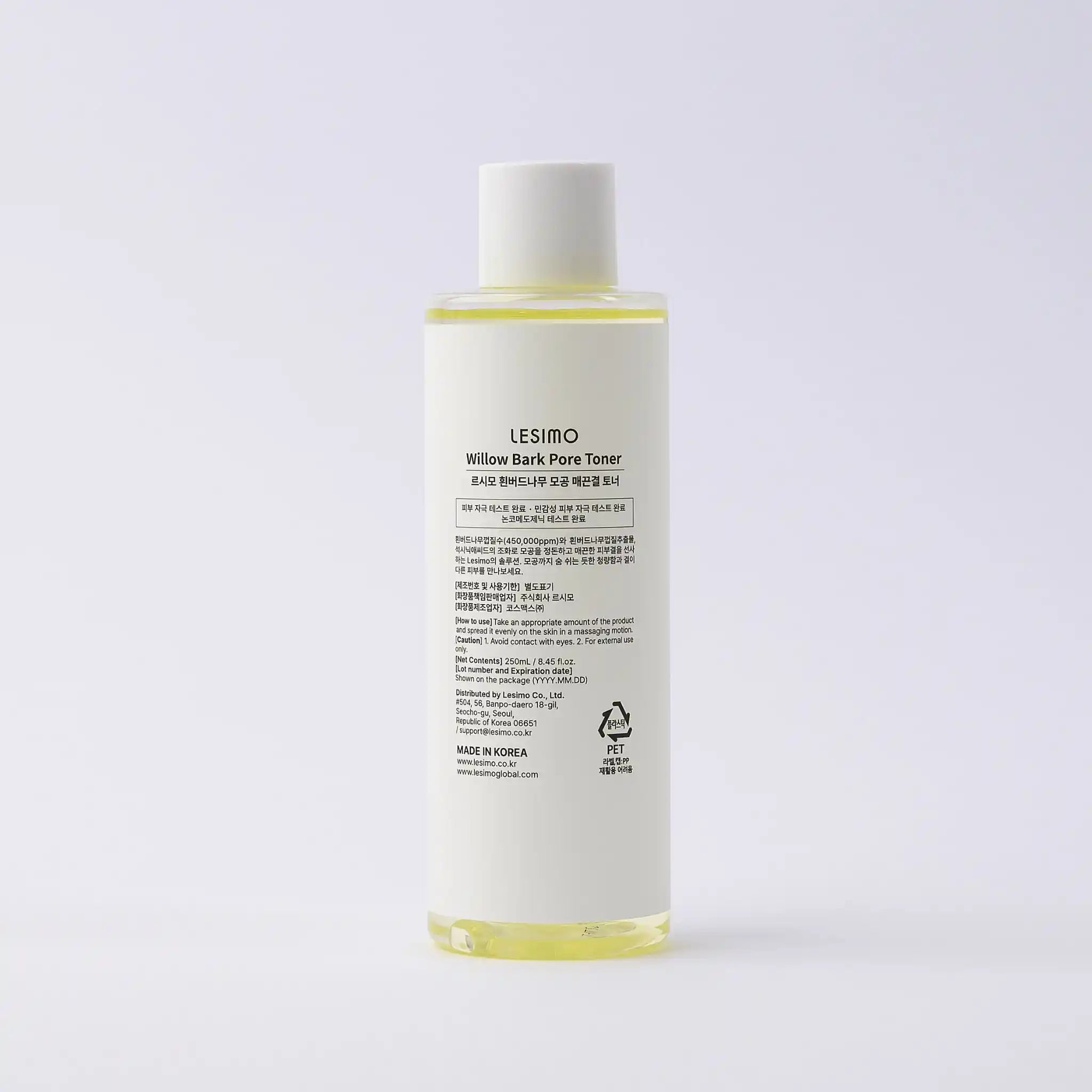 Skincare bottle with label on a light gray background