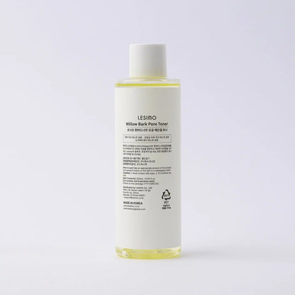 Skincare bottle with label on a light gray background