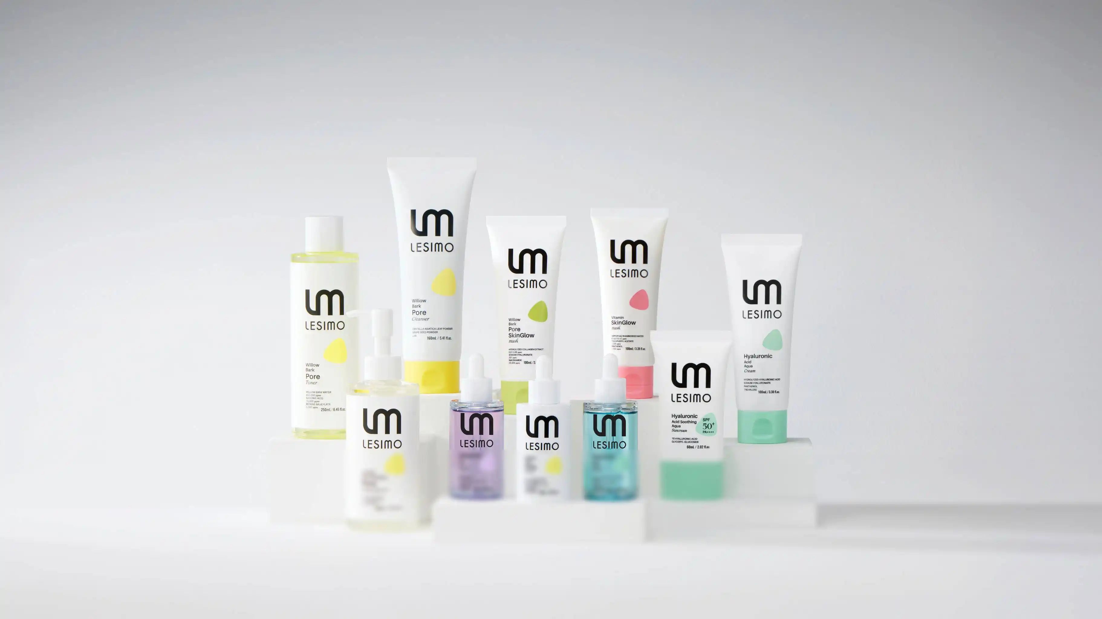 Collection of skincare products with visible brand logo on a gray background