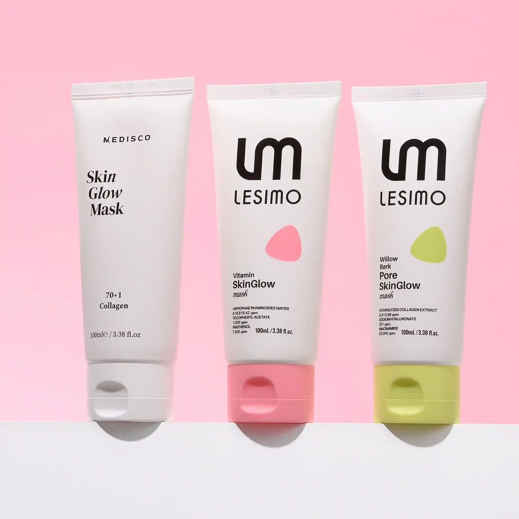 Three skincare tubes from Lesimo and Medisco lined up against a pink background: Skin Glow Mask, Vitamin skinGlow cream, and Purified skinGlow cream.