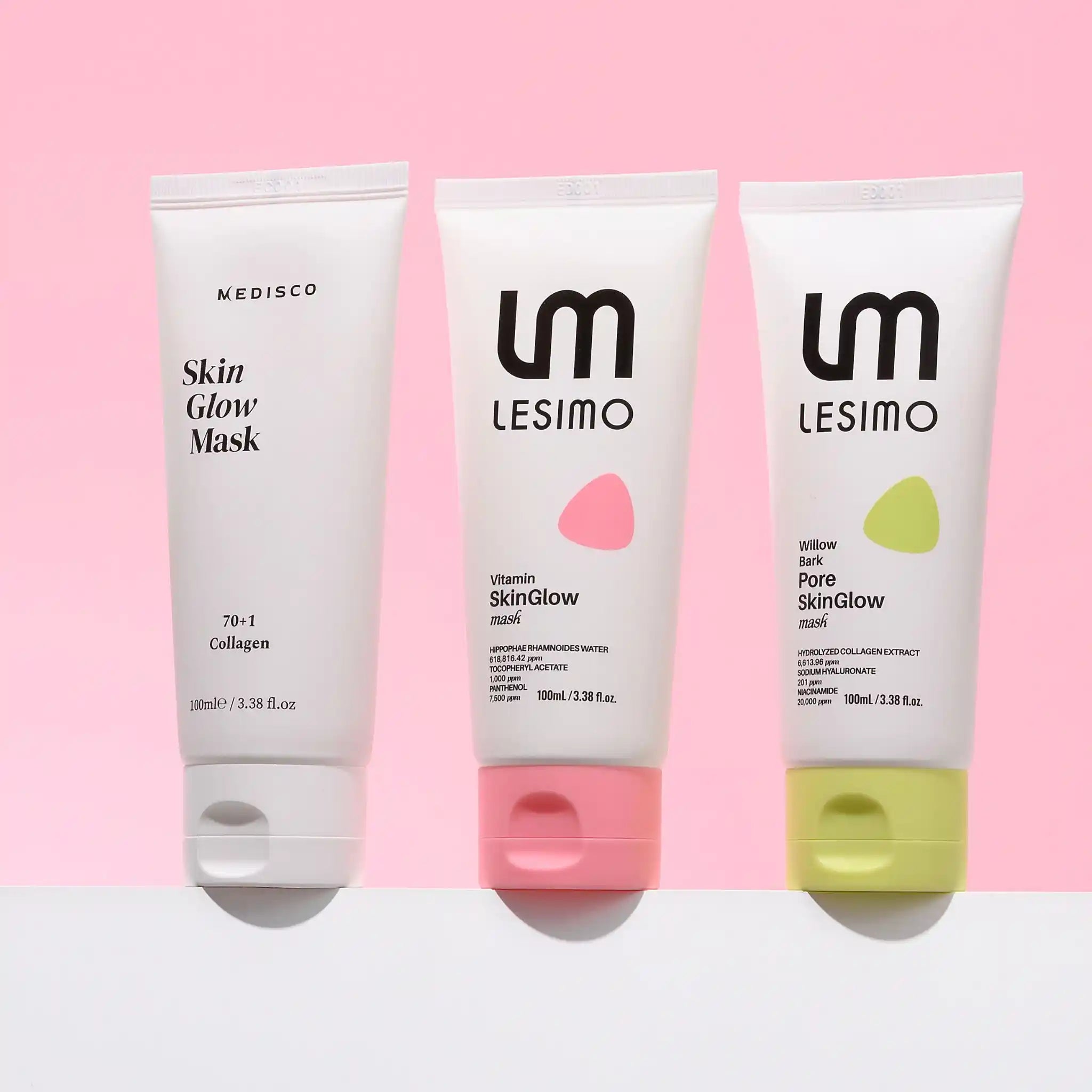 Three skincare tubes from Lesimo and Medisco lined up against a pink background: Skin Glow Mask, Vitamin skinGlow cream, and Purified skinGlow cream.